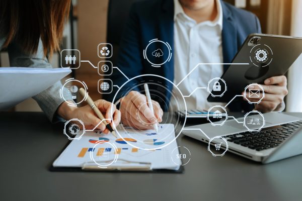 Working team meeting concept, business using laptop and smart phone and digital tablet computer with digital marketing media  in virtual icon network diagram office in morning light